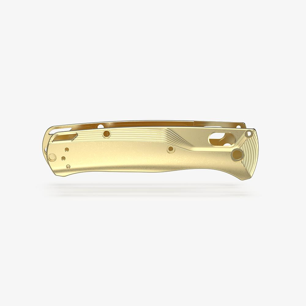 Pocket clip side of the custom brass Crossfade scales for the Benchmade Bugout knife.