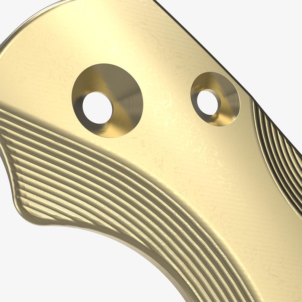 Detail shot of the brass scales for the Spyderco Paramilitary 2 knife.