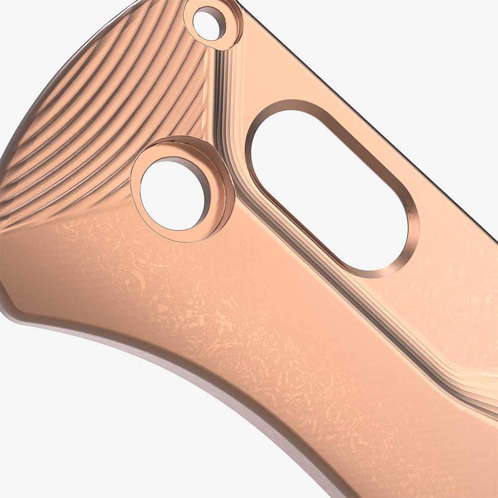 Detail shot of the custom copper scales for the Benchmade Bugout knife with a stonewash finish.