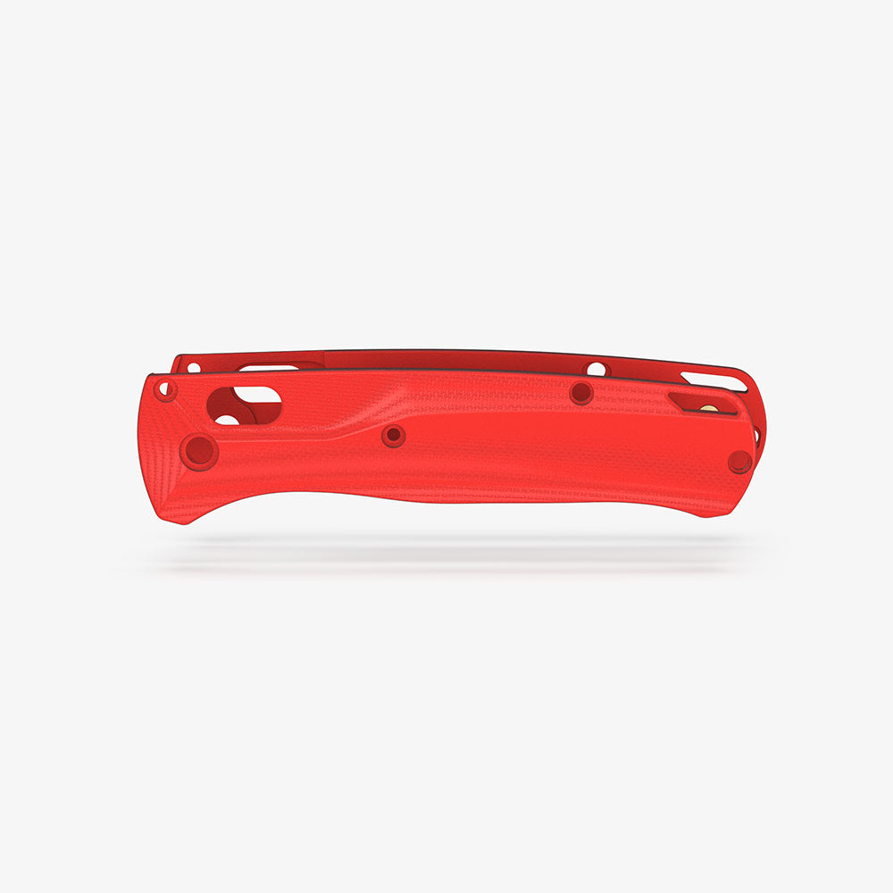 The Benchmade Bugout knife with custom Crossfade scales in red G-10.