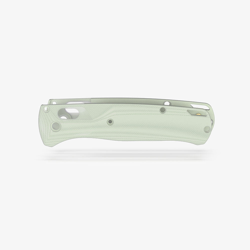 The Benchmade Bugout knife with custom Crossfade scales in natural jade G-10.