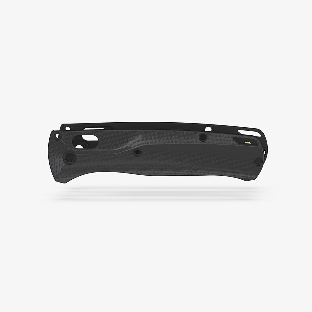 The Benchmade Bugout knife with custom Crossfade scales in black G-10.