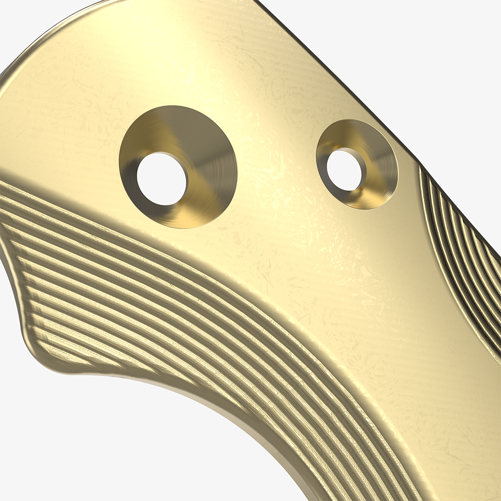 Detail shot of the brass scales for the Spyderco Paramilitary 2 knife. 