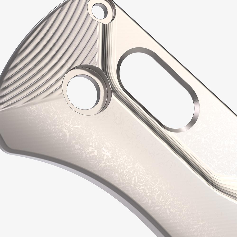 Detail shot of the titanium Crossfade scales for the Benchmade Bugout knife in a stonewash finish.